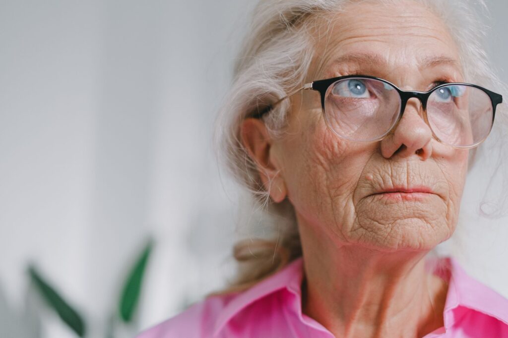 an elderly woman wearing eyeglasses