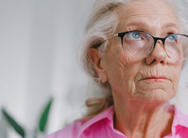 an elderly woman wearing eyeglasses